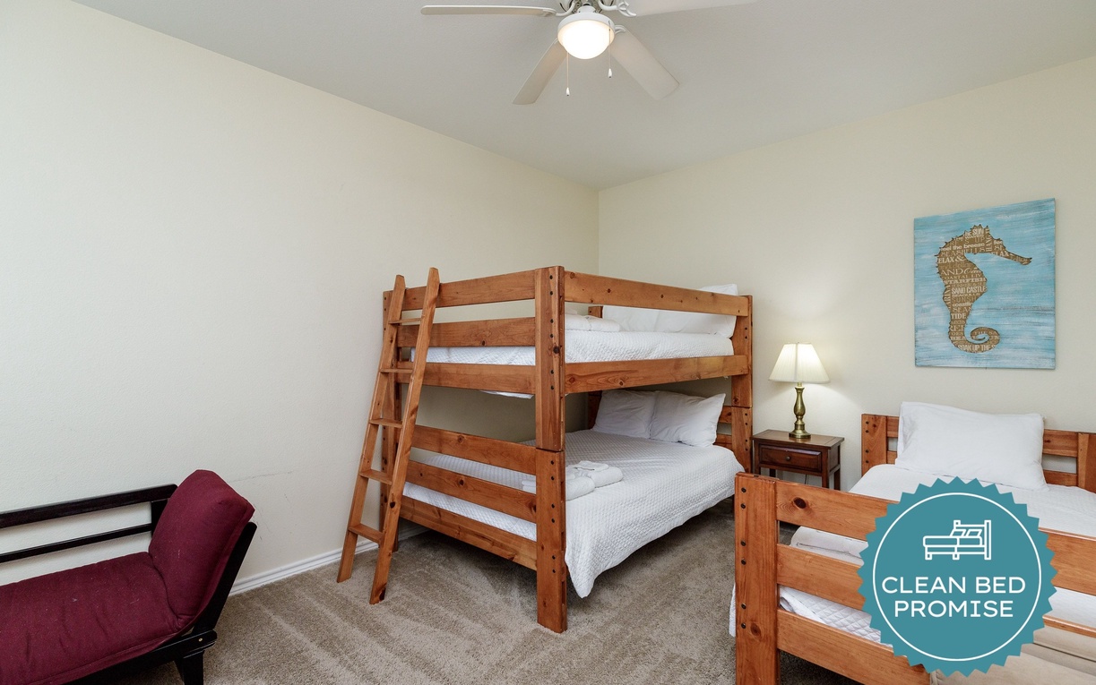 Sleep peacefully in this cozy bedroom with comfortable bunk beds and charming coastal decor that makes you feel right at home.