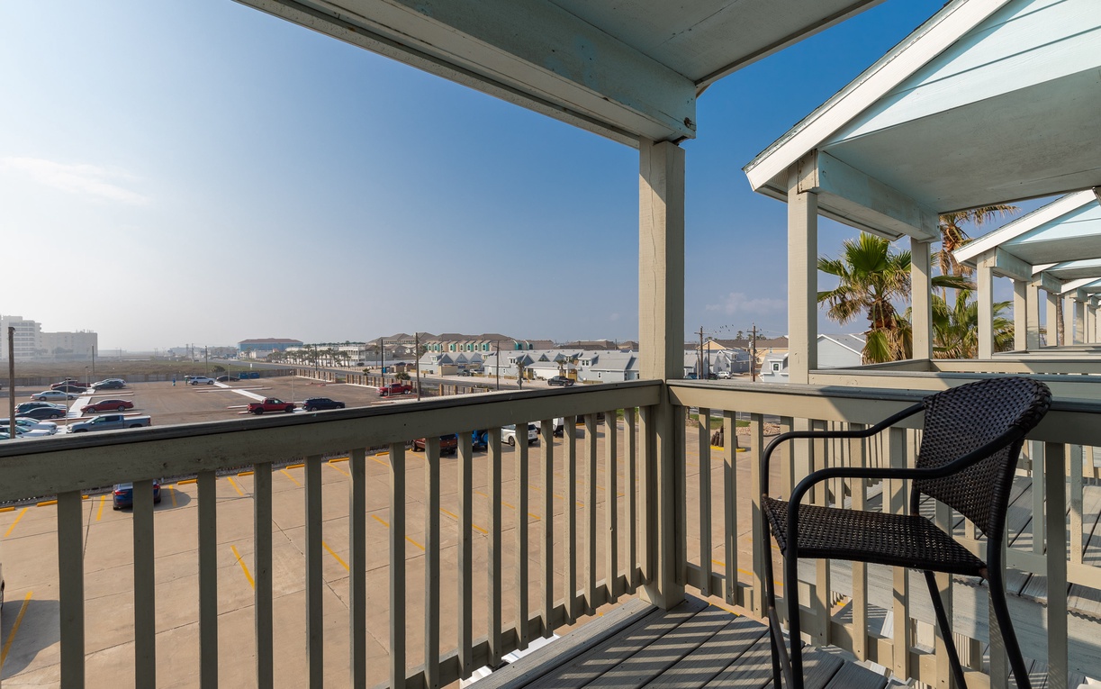 Step onto your private balcony and soak in coastal views while sipping morning coffee in comfortable wicker seating.