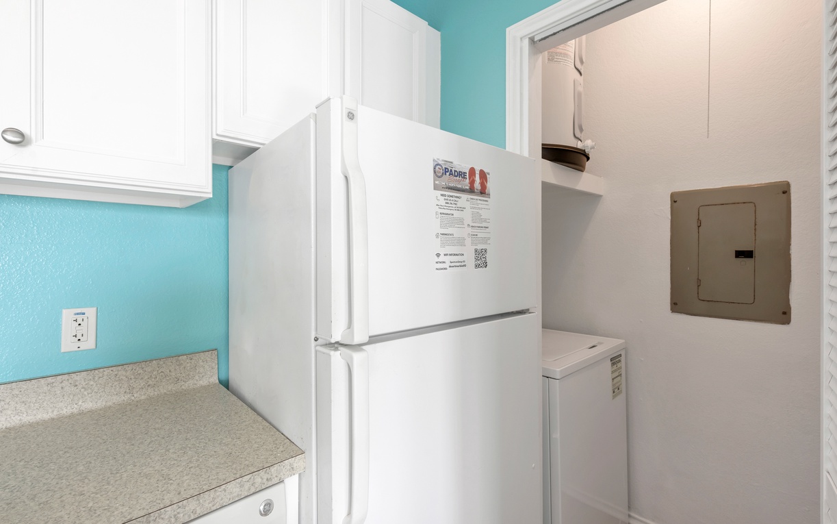 Your fully equipped kitchen features a spacious refrigerator and convenient in-unit washer and dryer for ultimate comfort.