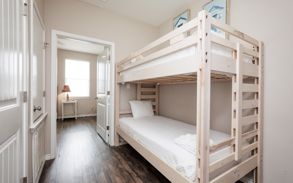 Rest comfortably in your private bunk room, featuring quality linens and thoughtful design for a peaceful night's sleep.