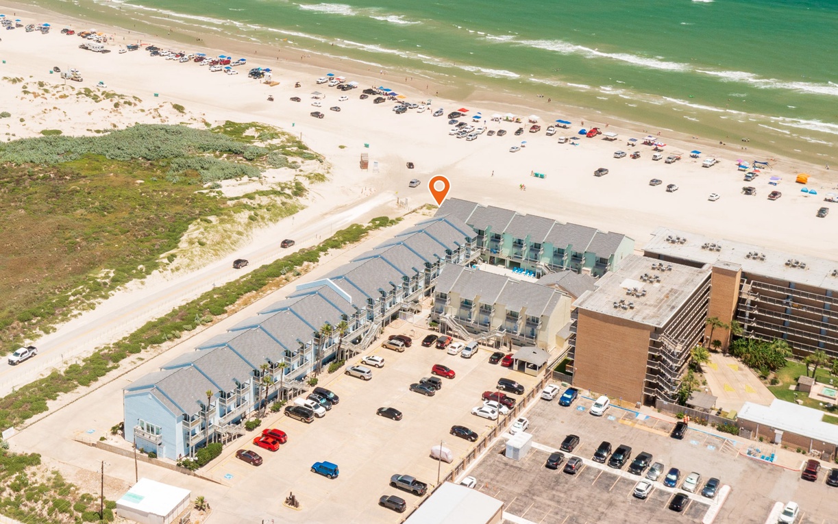 Beachfront property with direct beach access and convenient parking, perfectly positioned for your coastal getaway.
