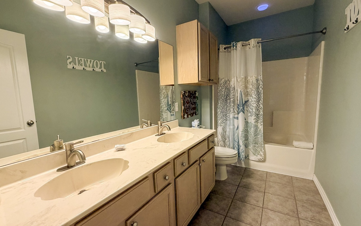 Master bathroom on the second floor with double sinks, along with tub and shower