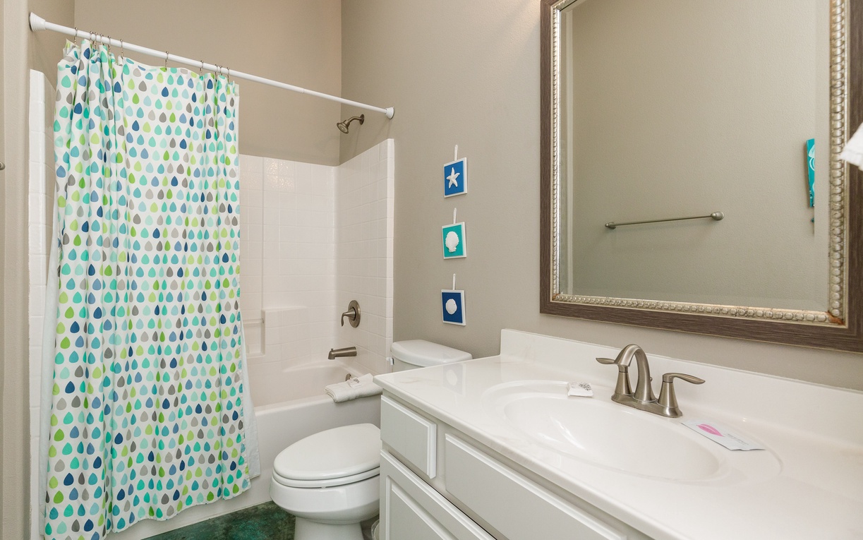 Step into your pristine bathroom featuring modern amenities and cheerful touches that make your daily routine feel refreshing.