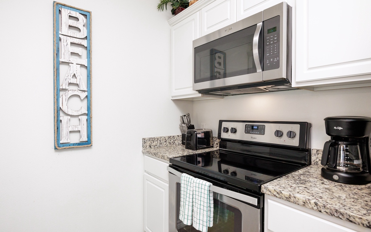 Your fully equipped kitchen features granite countertops, stainless appliances, and everything needed to whip up your favorite beach vacation meals.
