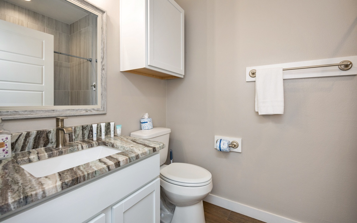 Your private bathroom features elegant marble countertops, modern fixtures, and fresh linens waiting for your arrival.