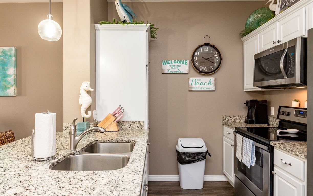 Your fully equipped kitchen awaits with granite counters, stainless appliances, and charming coastal touches that make meal prep a breeze.