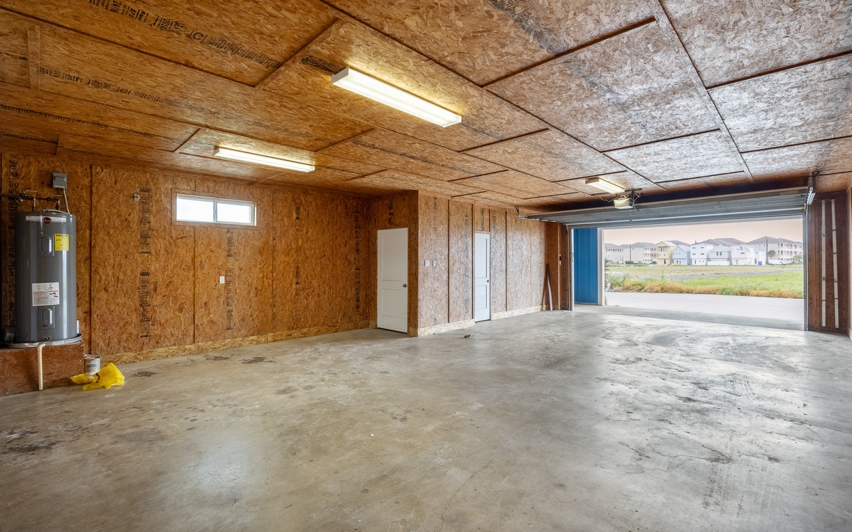 Spacious garage with convenient storage and room for multiple vehicles, plus easy access to your neighborhood.