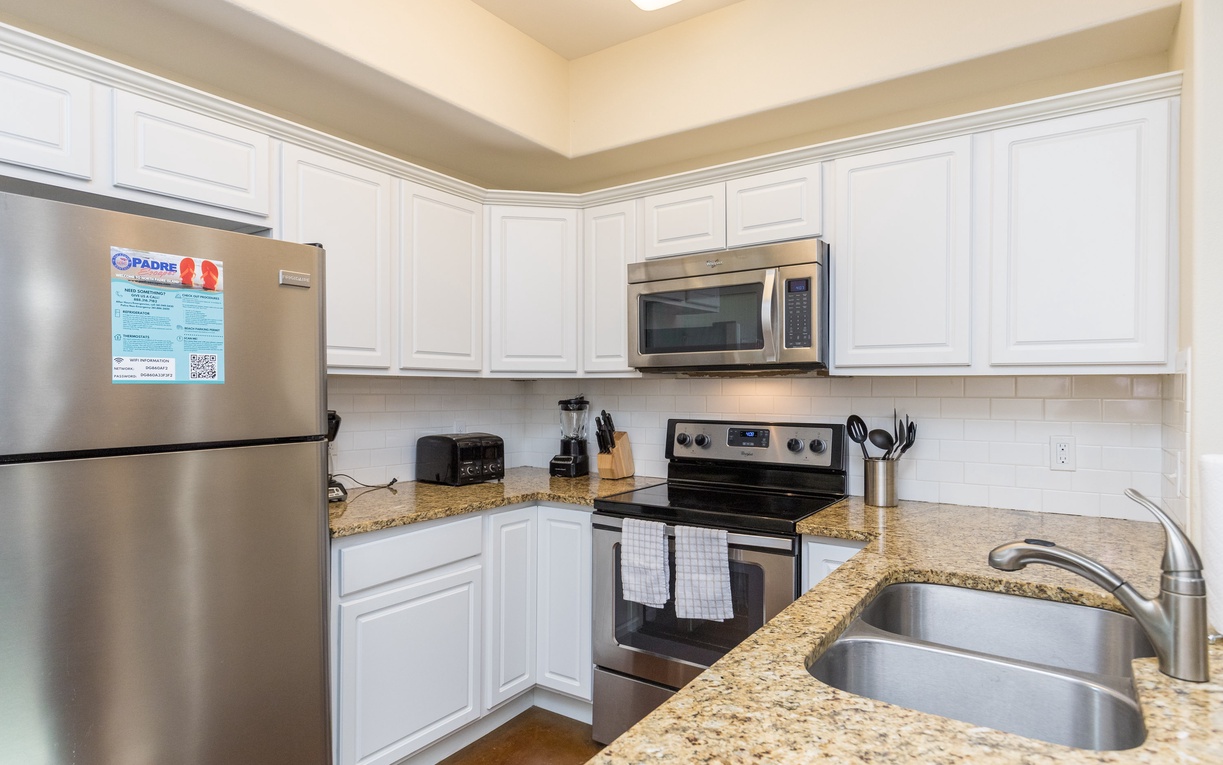 Your fully equipped kitchen features granite countertops, stainless steel appliances, and everything you need to create memorable meals during your stay.