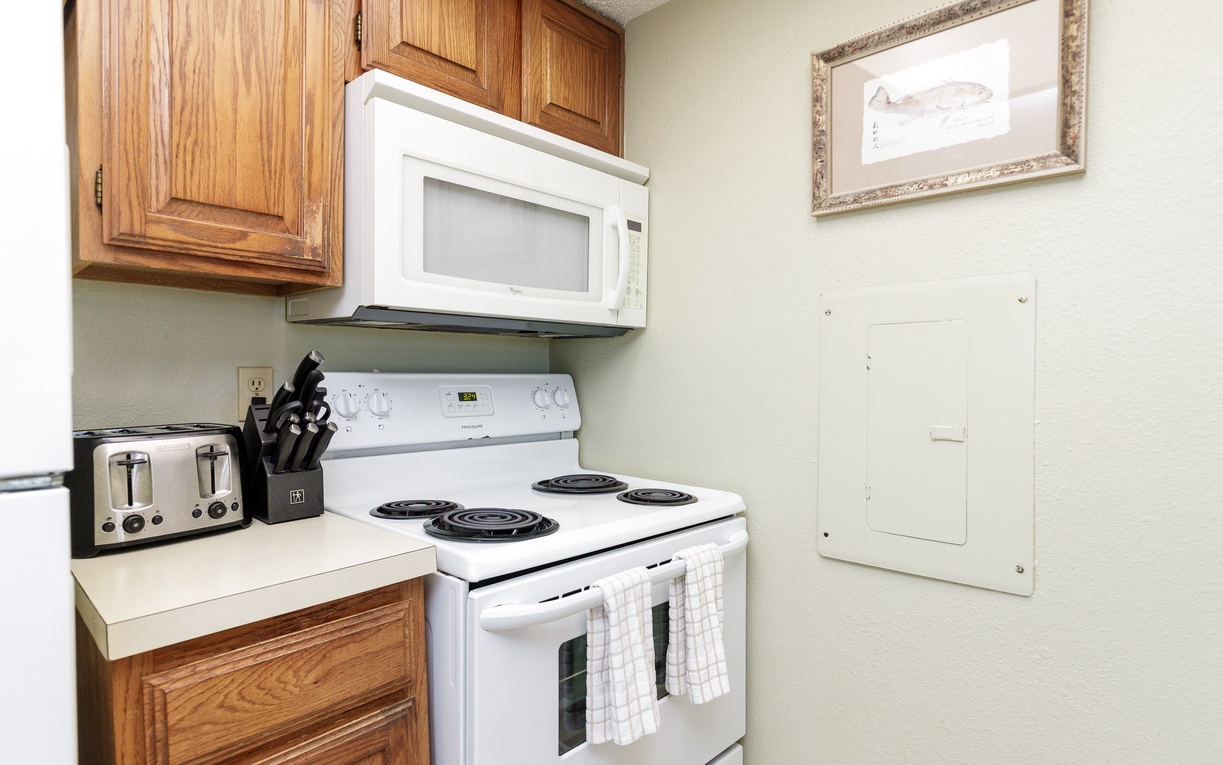 Your fully equipped kitchen features everything you need including microwave, stove, and toaster for preparing delicious home-cooked meals during your stay.