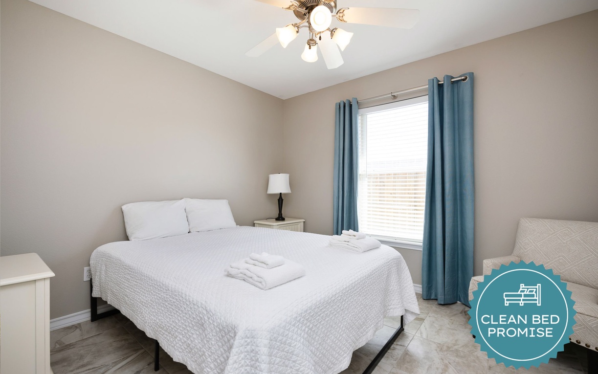 Sink into crisp white linens and enjoy peaceful moments in your serene bedroom retreat.
