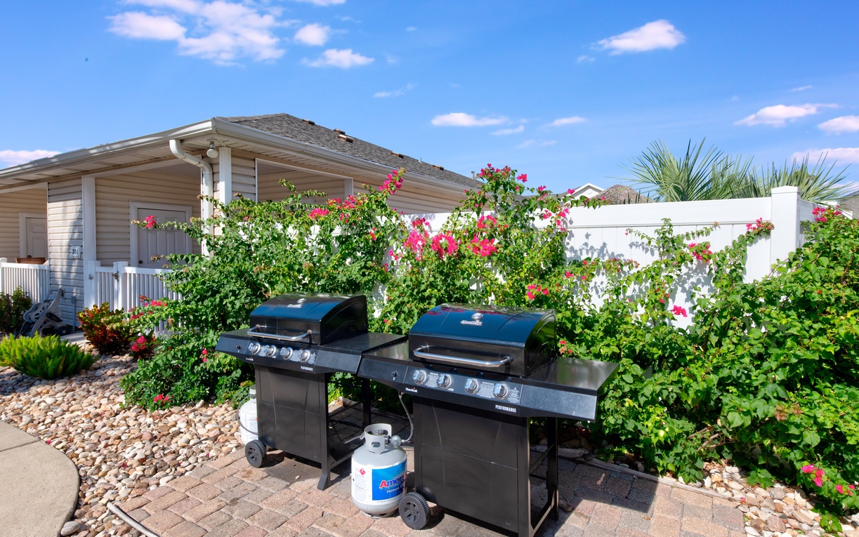 Fire up the grills for your perfect barbecue surrounded by vibrant tropical blooms and lush landscaping.