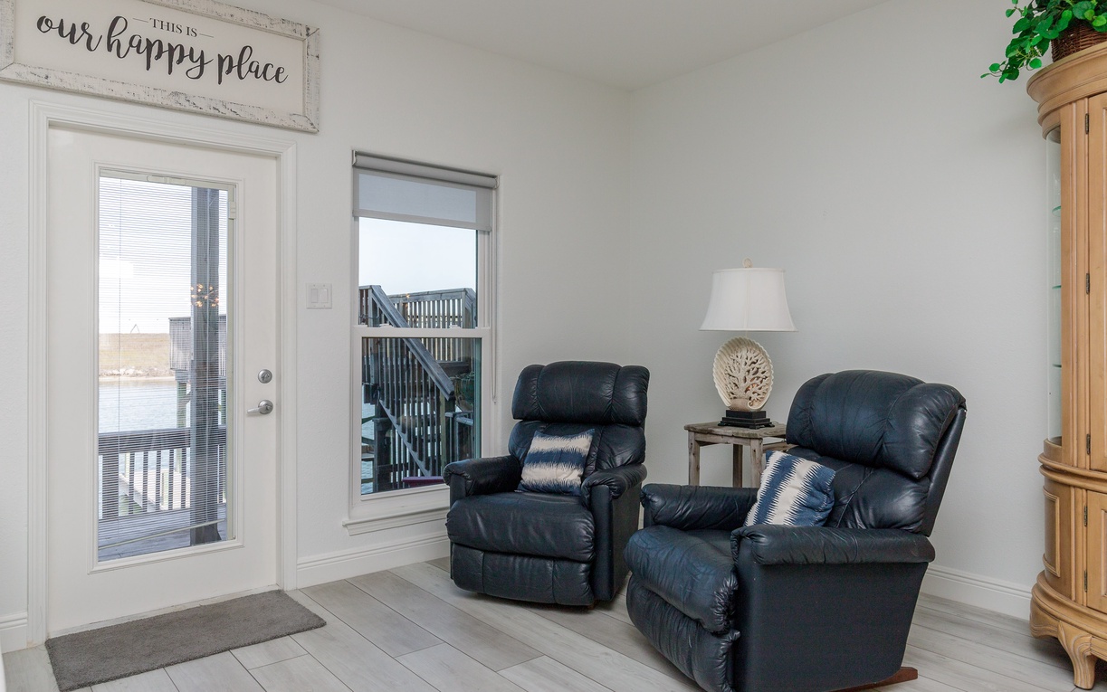 Sink into plush leather recliners where you can unwind with lake views through your private door to the deck.