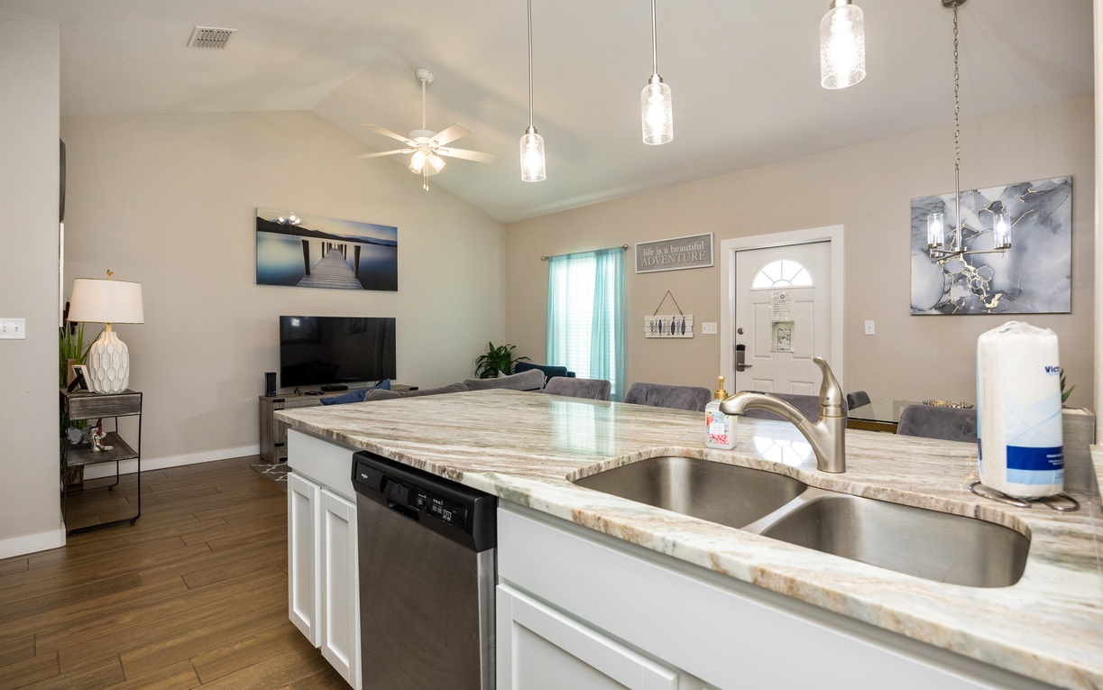 Your open-concept kitchen flows seamlessly into the living room, perfect for cooking while chatting with family or catching your favorite shows.