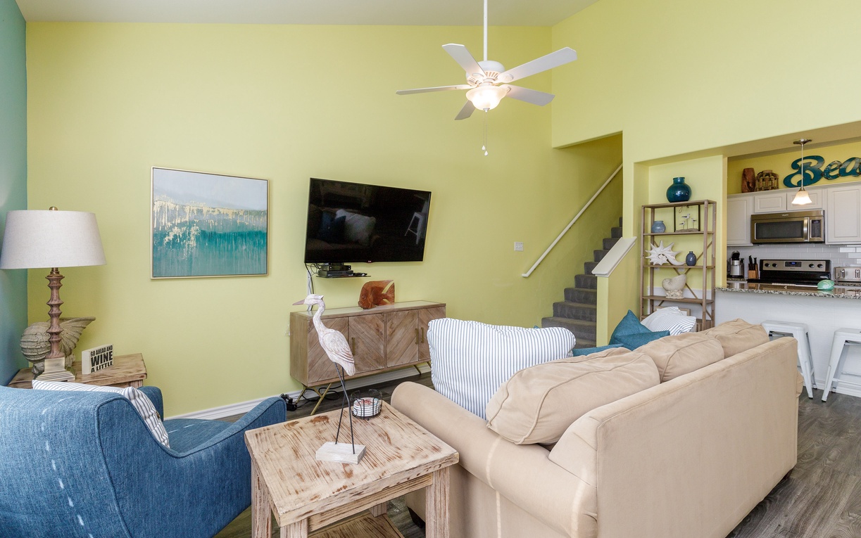 Unwind in your bright, open living space with comfortable seating and coastal charm throughout.