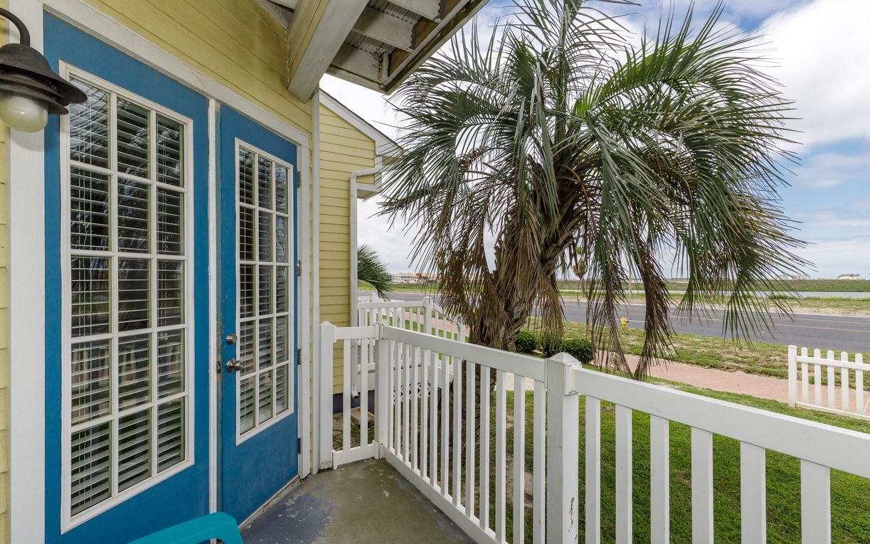 Step onto your private balcony and breathe in the coastal air, where tropical palms frame your peaceful escape.