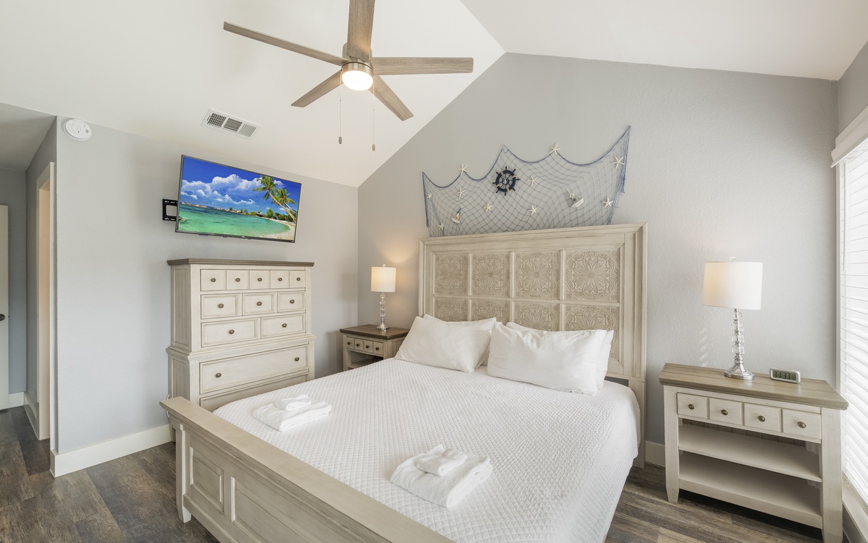 Drift into peaceful sleep in your nautical-themed bedroom, complete with a king size bed, ensuite bathroom, and private balcony.
