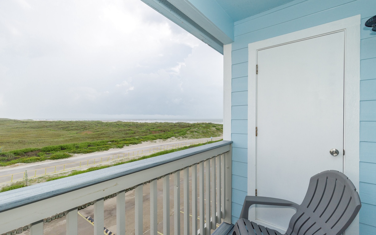 Your private balcony offers sweeping views across coastal grasslands, perfect for morning coffee or watching clouds drift over the horizon.