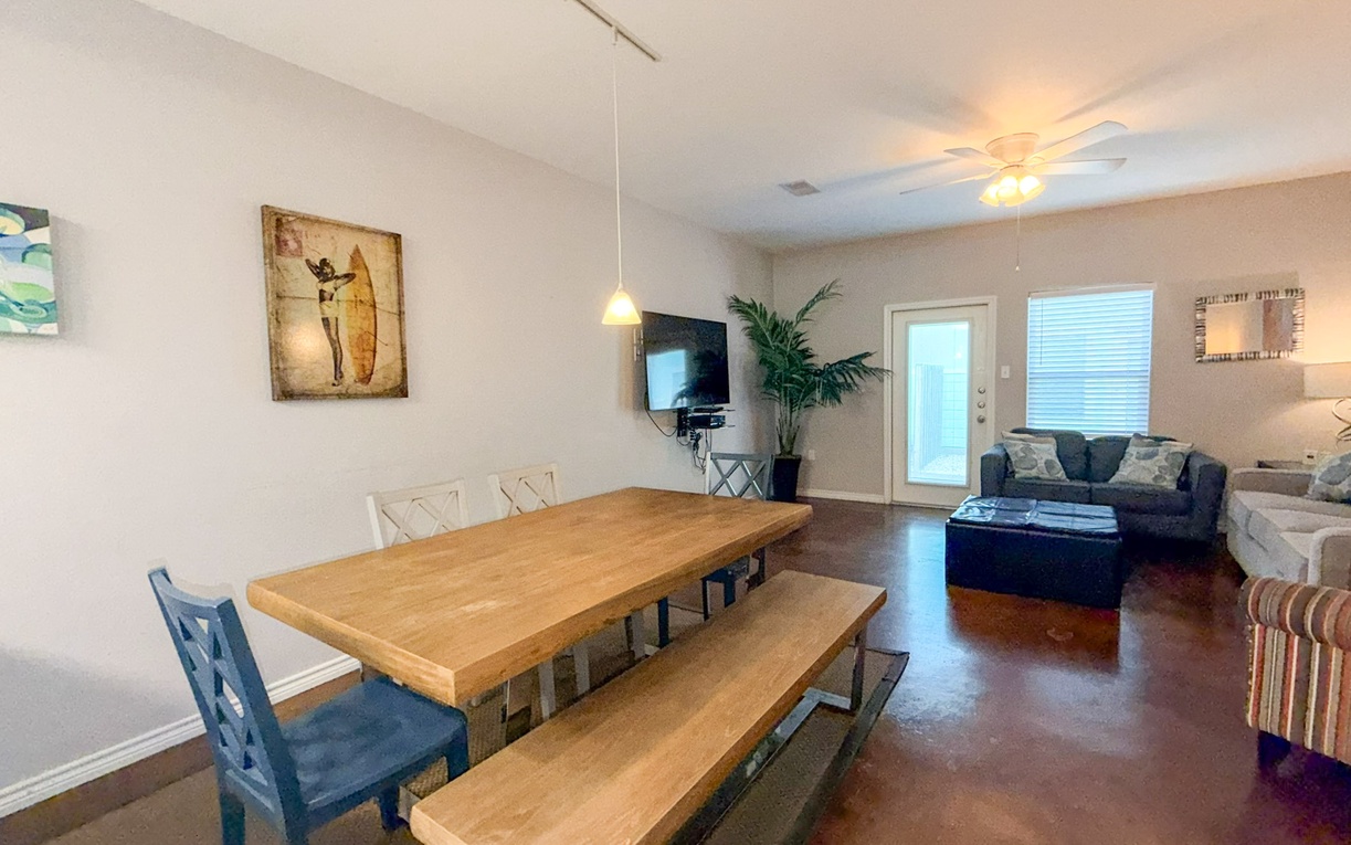Gather around the spacious dining table for memorable meals, then unwind in your comfortable living area with modern entertainment.
