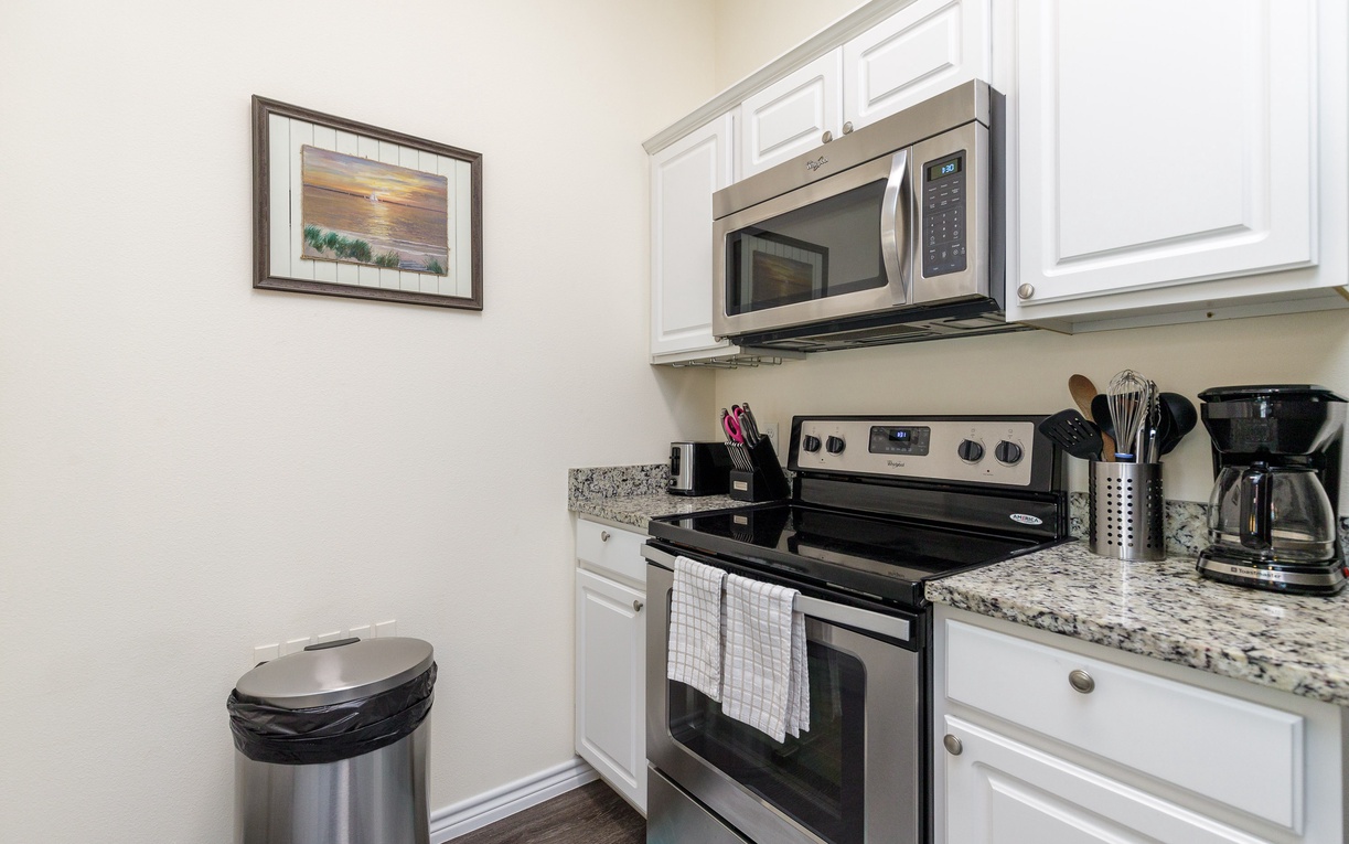 Your fully-equipped kitchen awaits with granite counters, stainless appliances, and everything you need to whip up delicious meals during your stay.