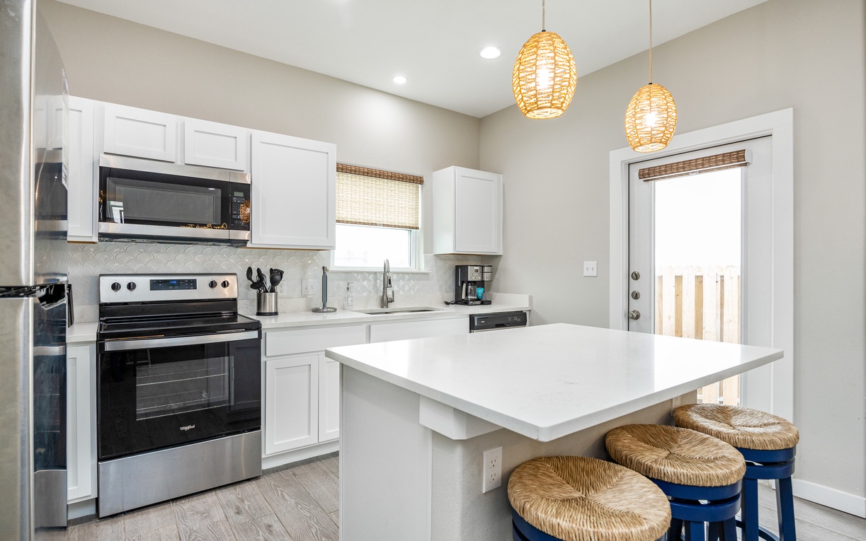 Your fully equipped kitchen features modern appliances and a breakfast bar where you can enjoy morning coffee together.