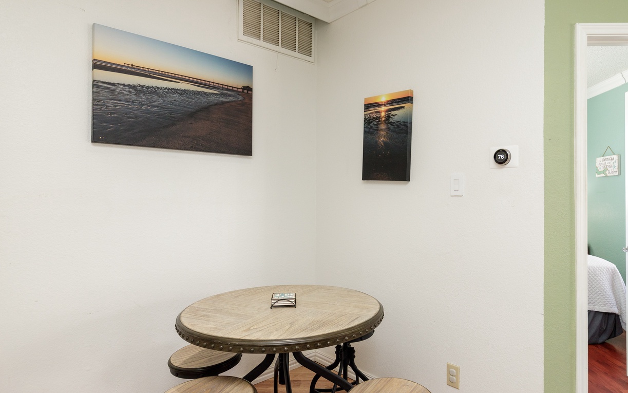 Your cozy dining nook features a charming round table perfect for morning coffee and intimate meals together.