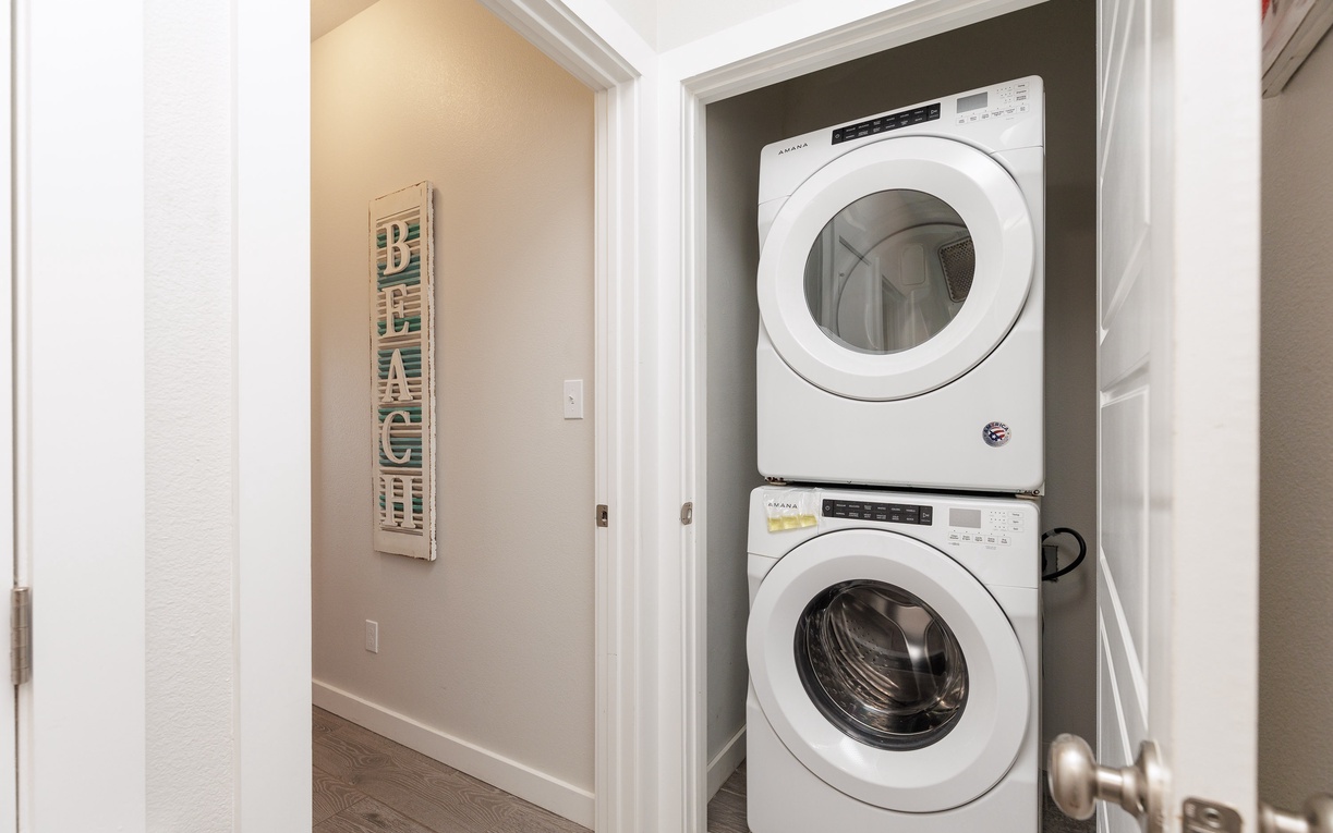 Your in-unit laundry closet features a stacked washer and dryer, making it effortless to keep your clothes fresh during your stay.