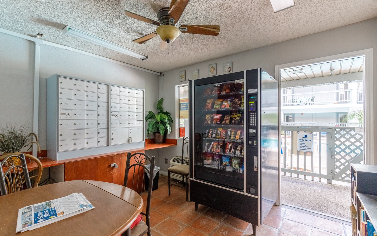 Convenient lobby area with vending machine, comfortable seating, and mailboxes for your stay needs.