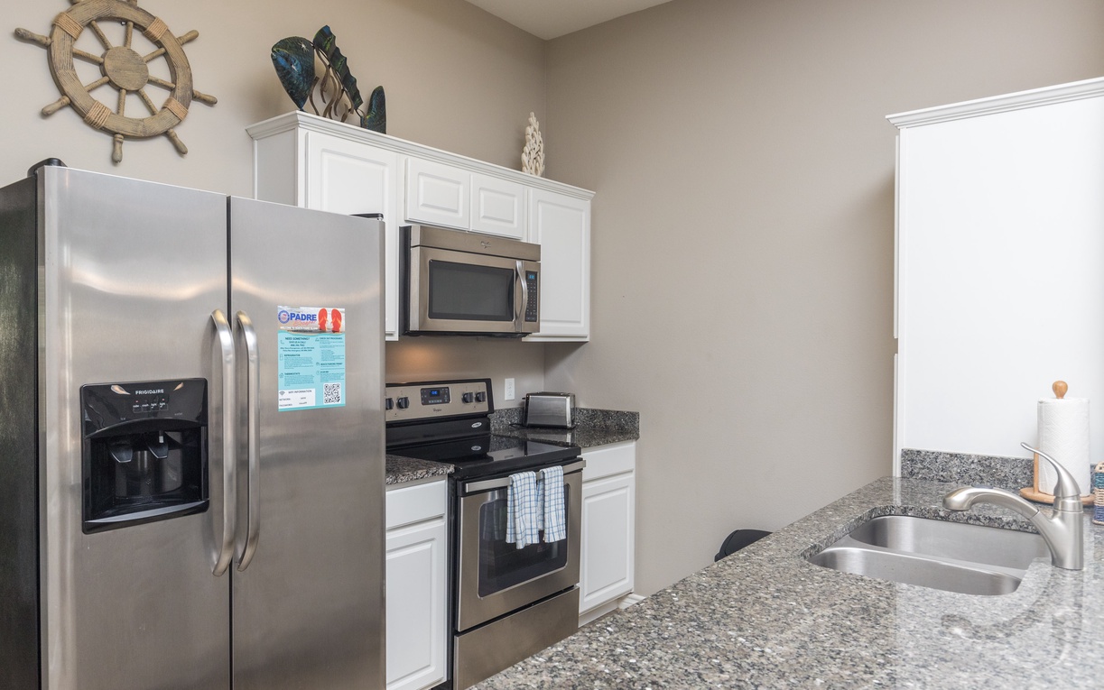 Your fully equipped kitchen features stainless steel appliances and granite countertops, perfect for preparing meals during your stay.