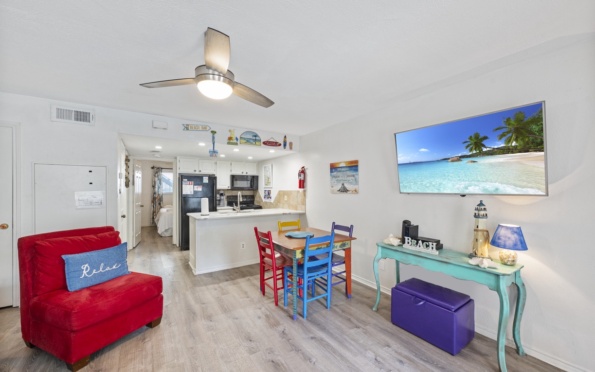 Unwind in your bright, cheerful living space with colorful furnishings and beach-themed touches that invite you to truly relax.