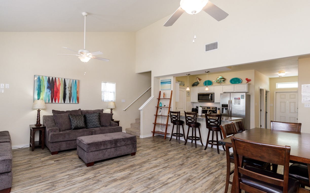 Relax in your spacious open-concept living area with comfortable seating, modern kitchen, and thoughtful touches that make you feel right at home.