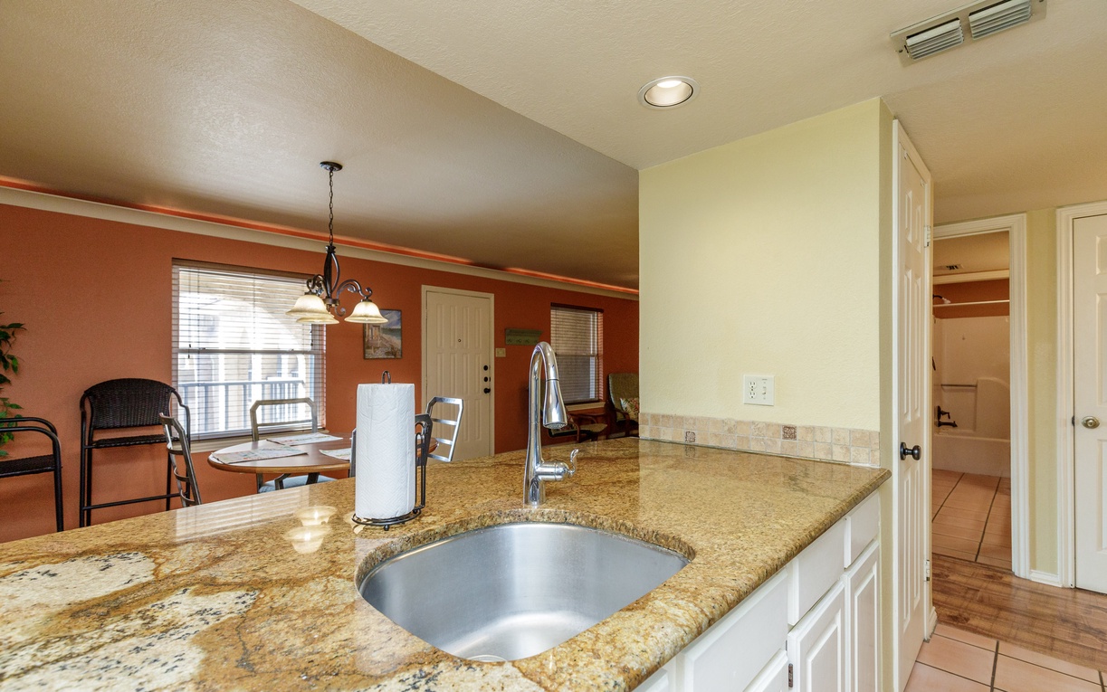 You'll love preparing meals at this gorgeous granite island with modern fixtures and open sightlines to your dining area.
