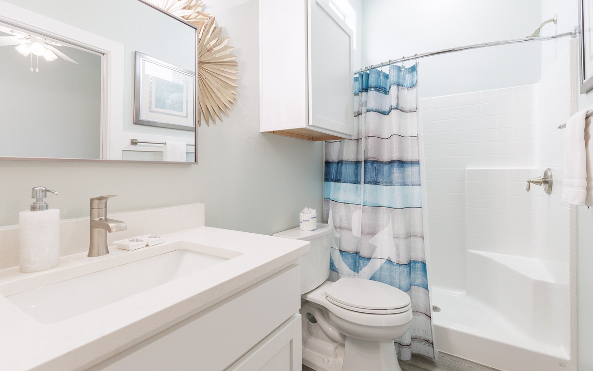 Step into your pristine bathroom with fresh linens, modern fixtures, and a relaxing tub perfect for unwinding after your adventures.