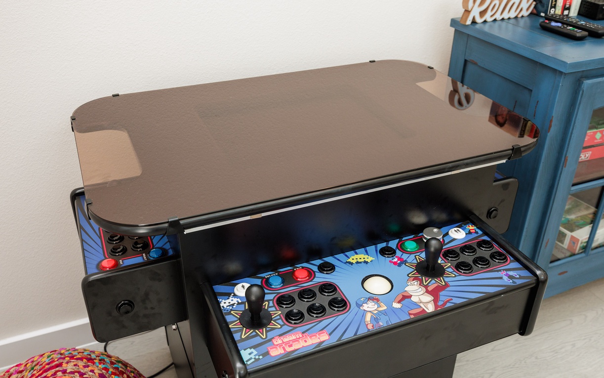 Your personal arcade table awaits with classic games and dual controls for endless entertainment during your stay.