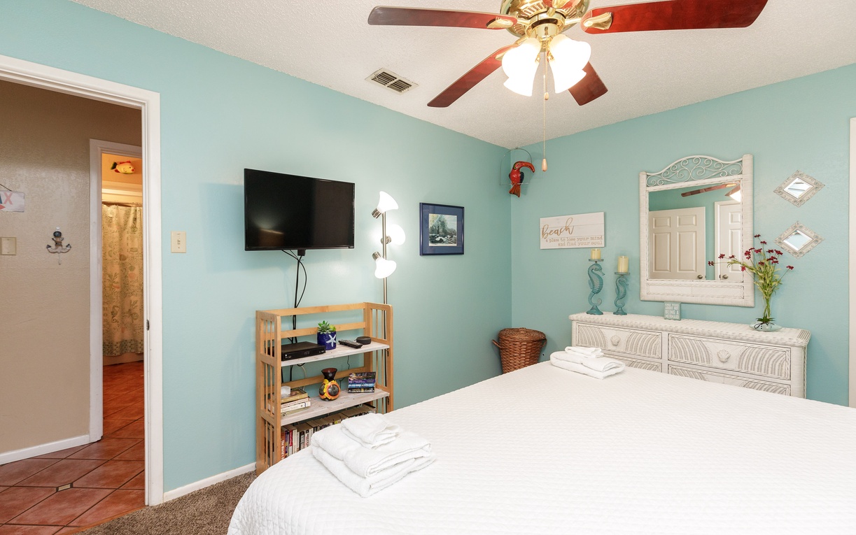 Drift into peaceful sleep in your serene coastal bedroom, where soft aqua walls and crisp linens create the perfect retreat.