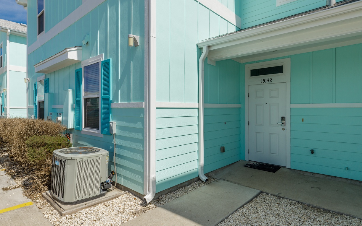 Charming turquoise beach cottage with private entrance and modern amenities awaits your coastal getaway.