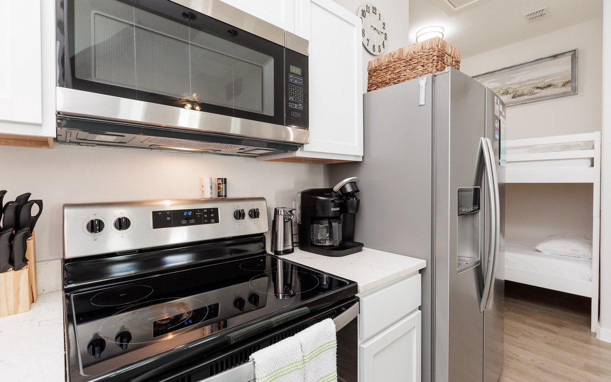 Your modern kitchen offers everything needed for home cooking with stainless appliances, granite counters, and convenient coffee station.