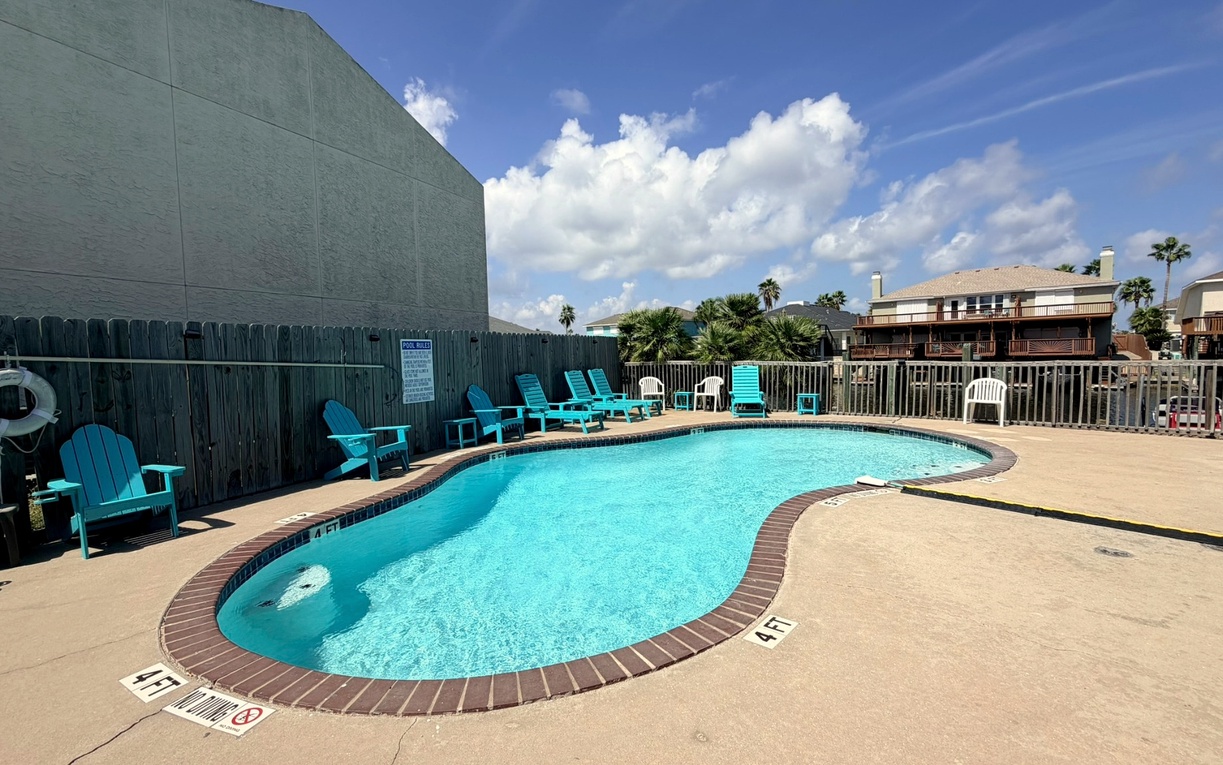 Sparkling turquoise waters and poolside seating create the perfect spot to relax and enjoy the sunshine.