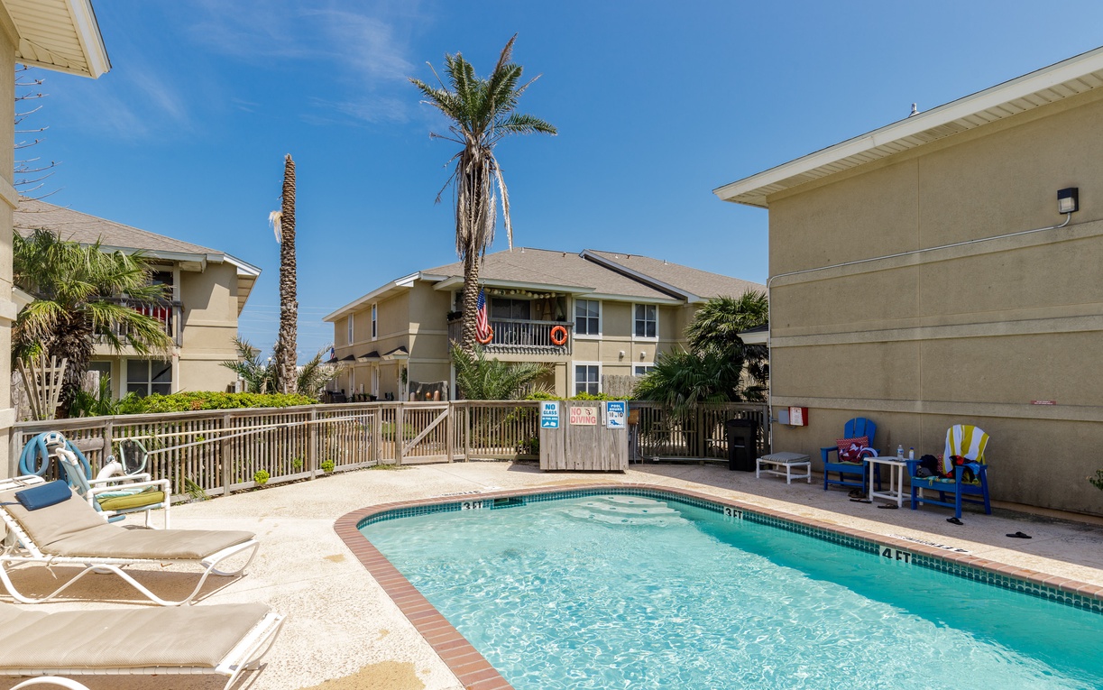 Take a refreshing dip in your private pool surrounded by swaying palms under sunny skies.