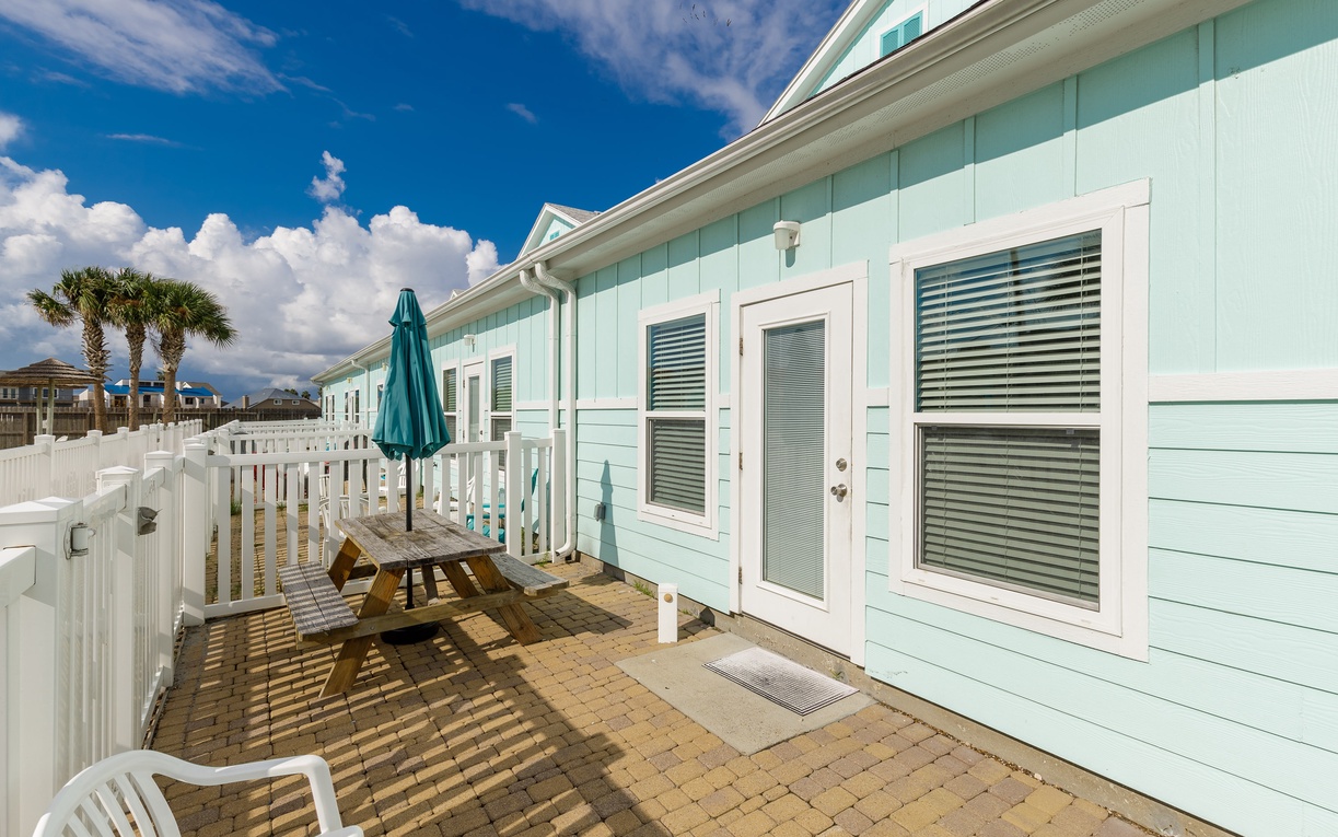 Your charming mint cottage features a private patio with picnic table and umbrella, perfect for morning coffee or sunset dining.