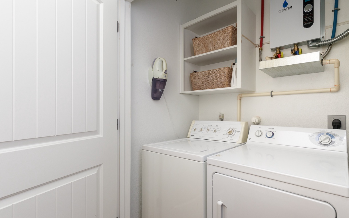 Your dedicated laundry space features a full-size washer and dryer with organized storage baskets, making extended stays effortless and convenient.