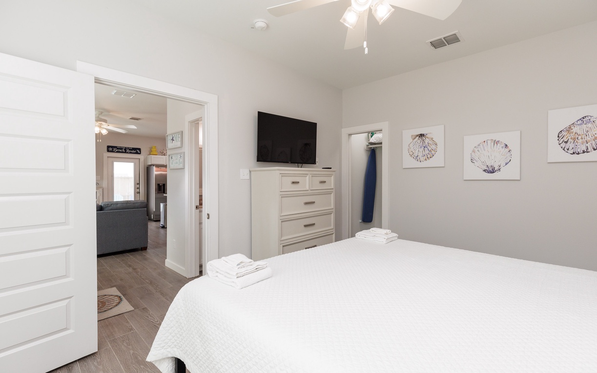 Drift off to peaceful sleep in your bright, airy bedroom with queen size bed, and modern comforts like TV entertainment.