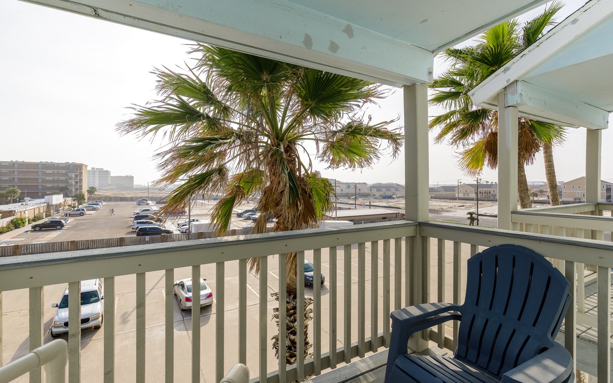 Relax in your cozy beach chair while sipping morning coffee, watching palm trees sway just beyond your private balcony.