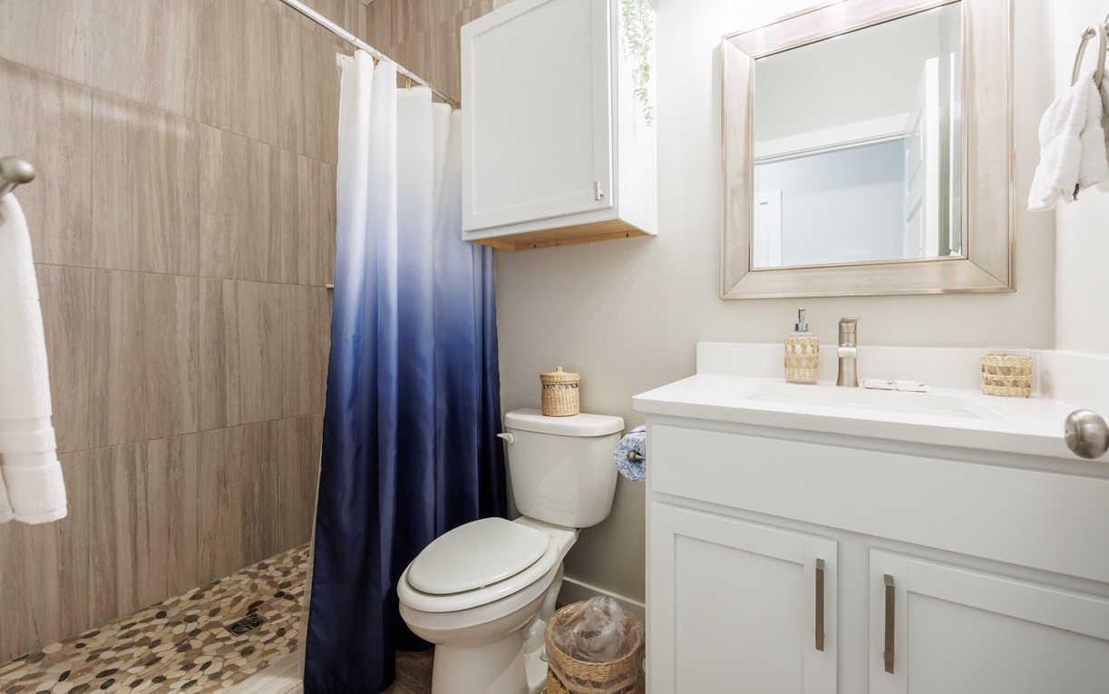 Your bright bathroom combines modern comfort with thoughtful design touches for a relaxing start to each day.