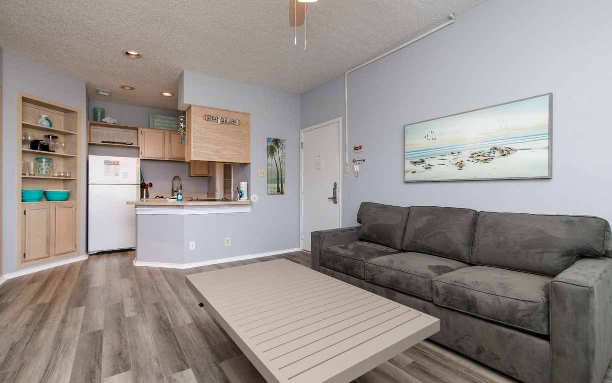 Unwind on your plush sofa while enjoying ocean views and the fully-equipped kitchen just steps away.
