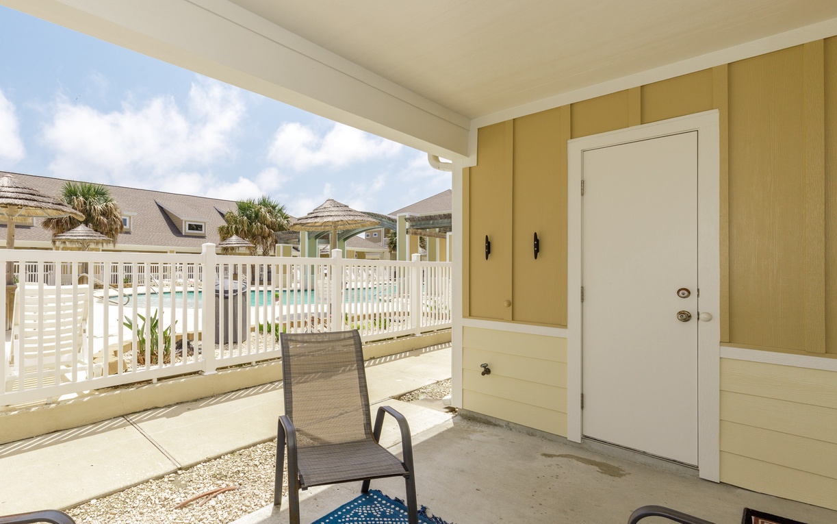 Step onto your private covered patio and relax in your poolside chair, watching turquoise waters shimmer beyond the white railings.