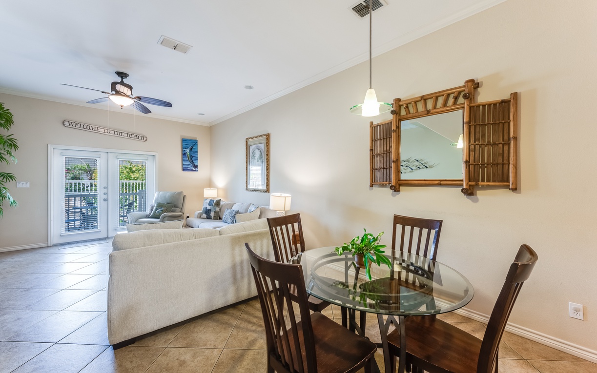 Relax in your open-concept living space where the dining area flows seamlessly into the comfortable living room, perfect for gathering with loved ones.