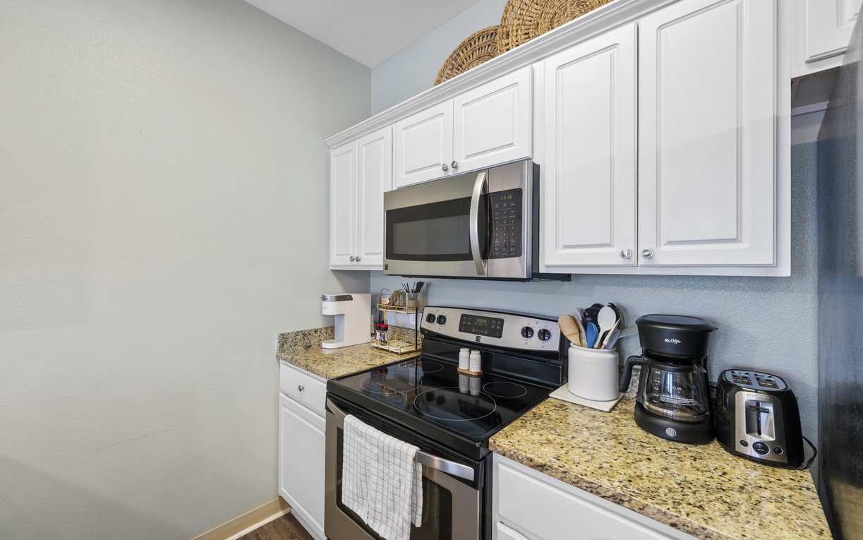 Your fully equipped kitchen awaits with granite counters, stainless appliances, and everything needed for home-cooked meals during your stay.