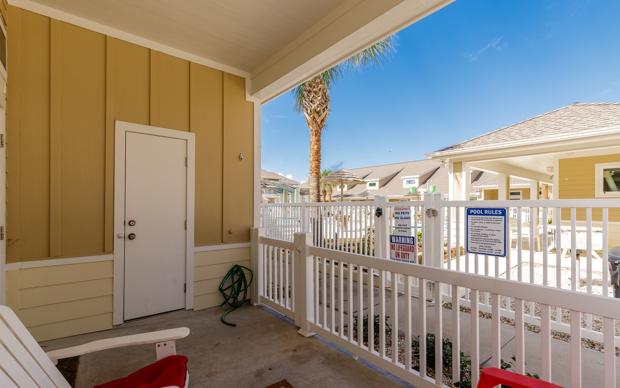 Step onto your private covered balcony and breathe in the warm coastal air while enjoying peaceful pool views.