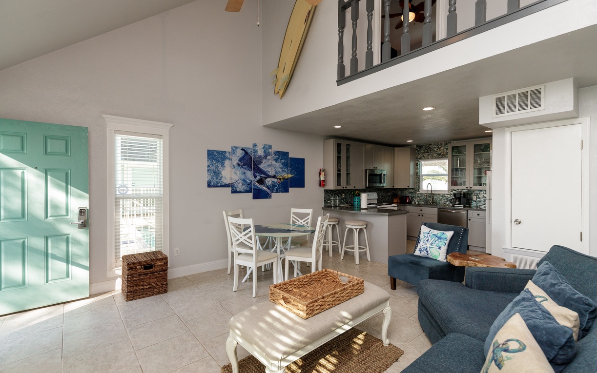 You'll love this bright open-concept space where coastal blues meet modern comfort, perfect for relaxing after your beach adventures.