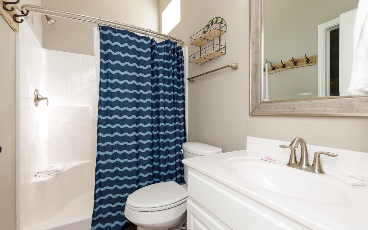 Your private bathroom features a spacious shower, comfortable vanity area, and thoughtful storage solutions for a refreshing start to each day.